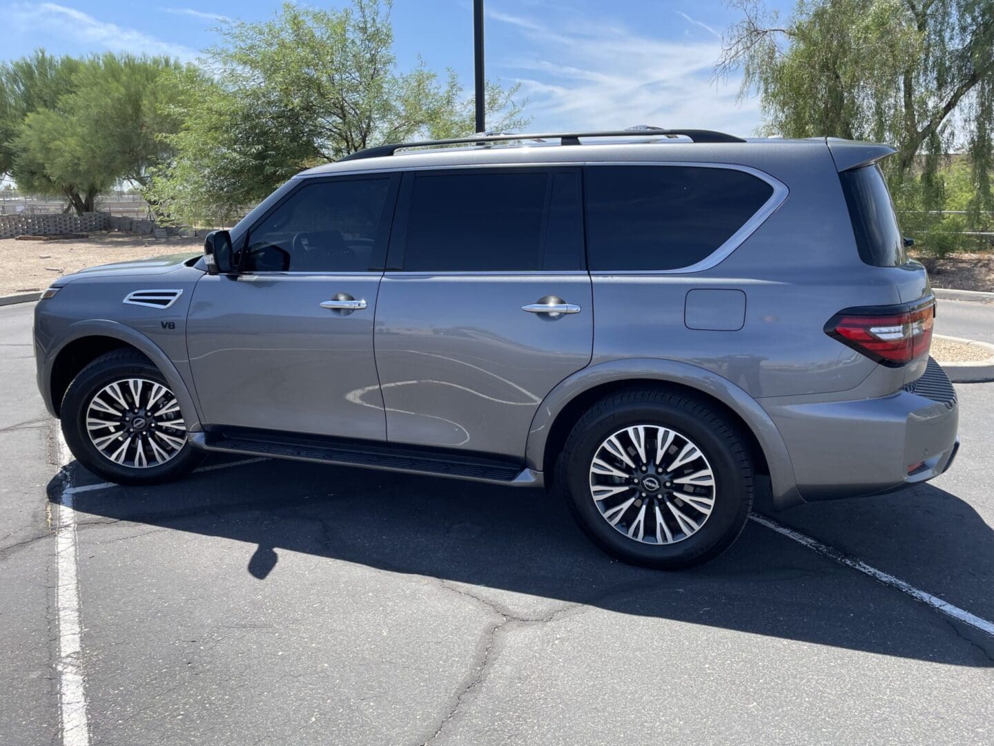 A silver suv parked in the parking lot.